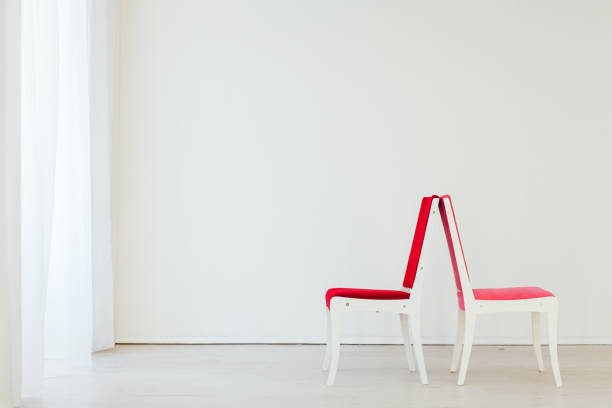 istock two chairs in the interior of an empty white room 1217178645