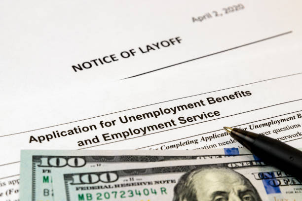 istock Job layoff notice and application for unemployment insurance benefits paperwork. Concept of Covid-19 coronavirus and stay at home order impact on economy 1217180607