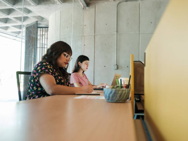 istock Two female workers sitting calmly in open space 1217181075