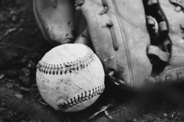 istock Baseball glove with ball in black and white close-up 1217183147