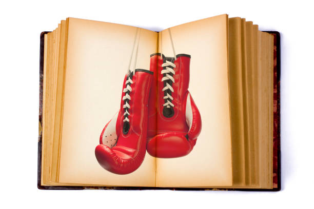 livre ouvert avec un gant de boxe - boxing glove sports glove isolated old photos et images de collection