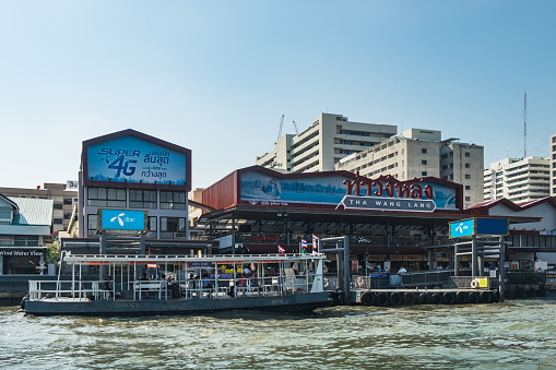 Bangkok, Thailand - March 2, 2018: Crowd of people on Tha Chang - Wang Lang Pier, stop on Route of Chao Phraya Express Boat in Bangkok, Thailand