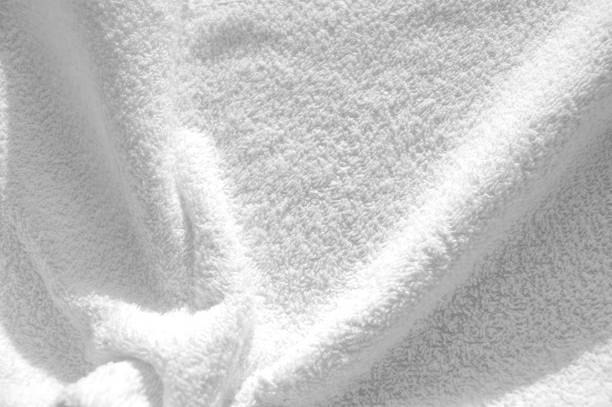 istock A Terry towel, a simple example of the texture of a soft, white, fleecy fabric 1217184918