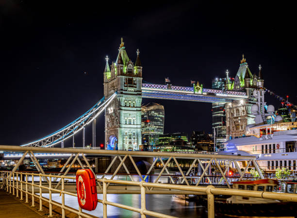 istock Tower bridge at long exposire in the night, London 1217185363