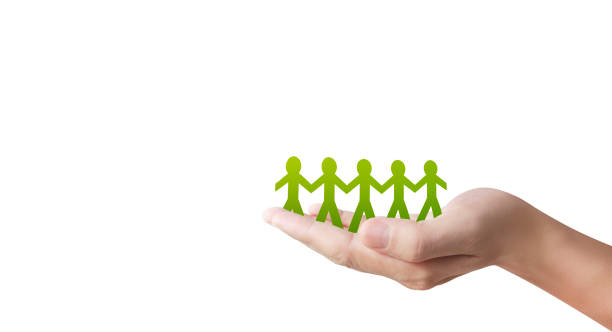 istock Human shape in paper cut with hand by hand or shake hand in hand 1217186477