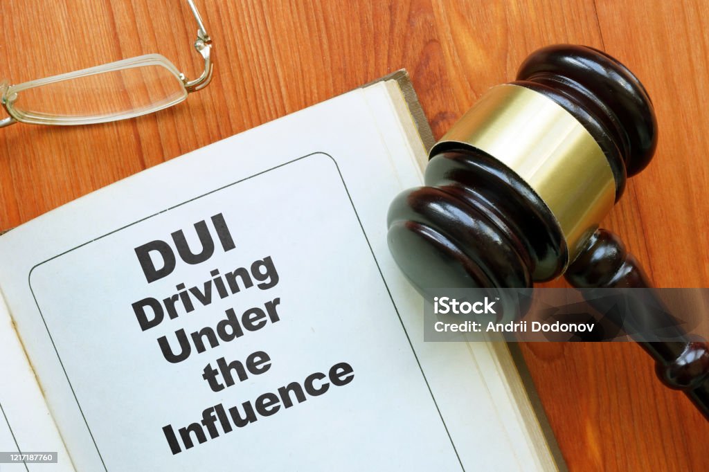 Conceptual hand written text showing DUI driving under the influence Driving Under The Influence Stock Photo