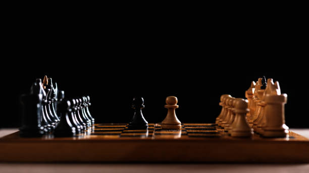 istock Vintage handmade wooden chess board and figures 1217189705