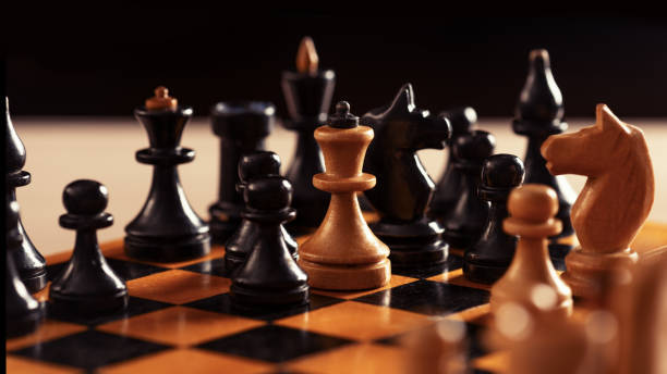 istock Vintage handmade wooden chess board and figures 1217189884