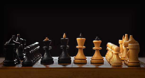 istock Vintage wooden chess board and figures 1217189944