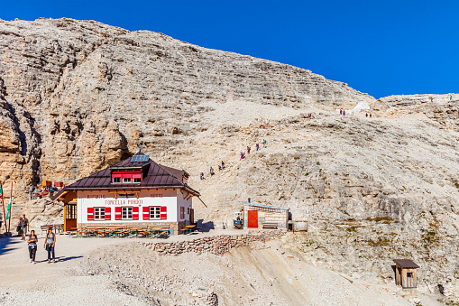 Hikers at the Rifugio Forcella Pordoi, one of the alpine huts of the Sella Group in the Dolomites.