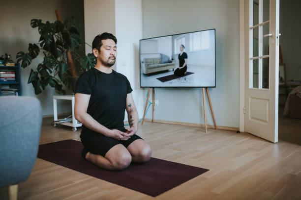 istock Japanese man exercising at home 1217191829