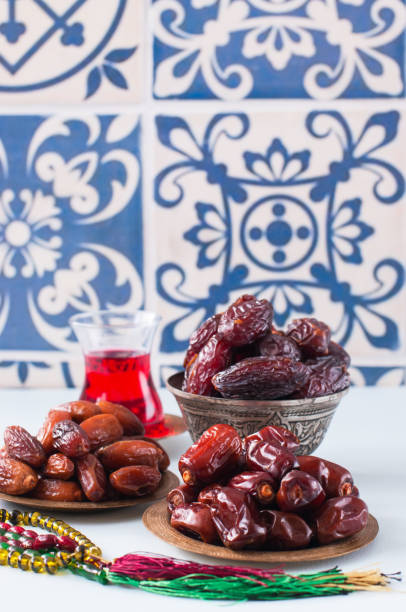 istock Assorted dried dates or kurma served on a vintage plates and tea. 1217192308
