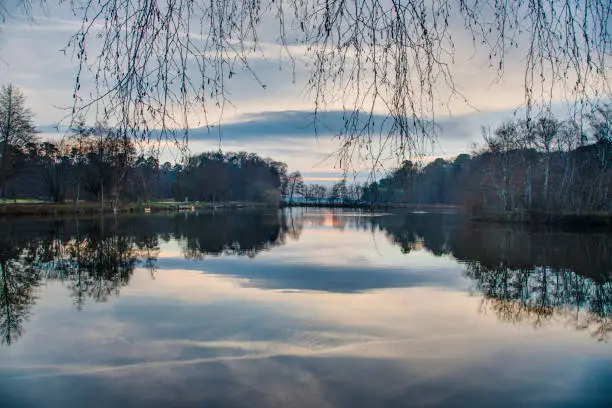 Reflections in a lake at Gundwiesen recreation area near Frankfurt airport