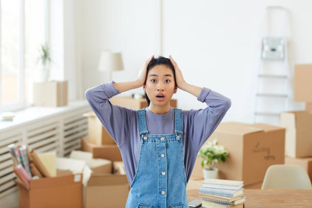 istock Young Asian Woman Panicking when Moving Out 1217193664