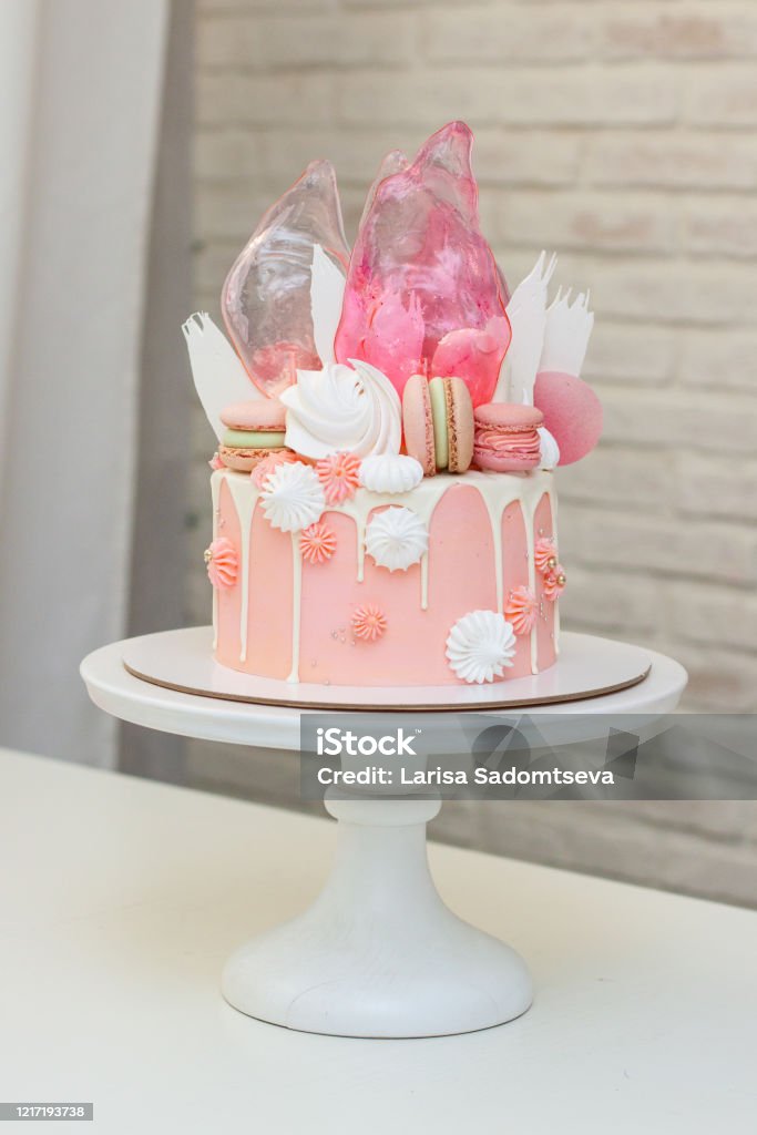 Modern Pink Cake With Chocolate Decor Caramel French Macaroons Meringues  And Waffle Paper White Background Stock Photo - Download Image Now - iStock
