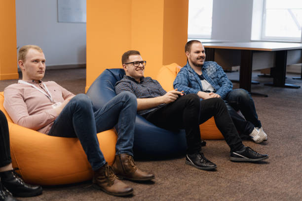 istock An IT team Play video games on the console while relaxing after work 1217195231