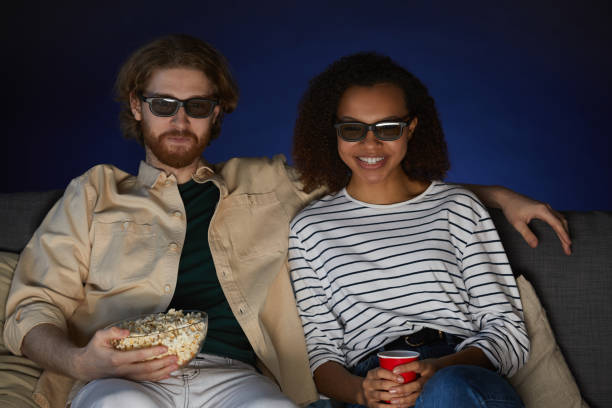 istock Modern Couple Watching Movie 1217195847