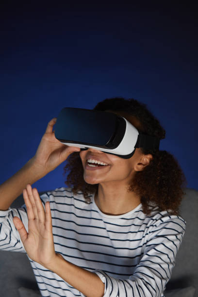 istock African Young Woman Enjoying VR Simulator 1217196170
