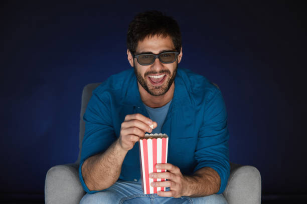 istock Man Watching Movie at Home Alone 1217196940