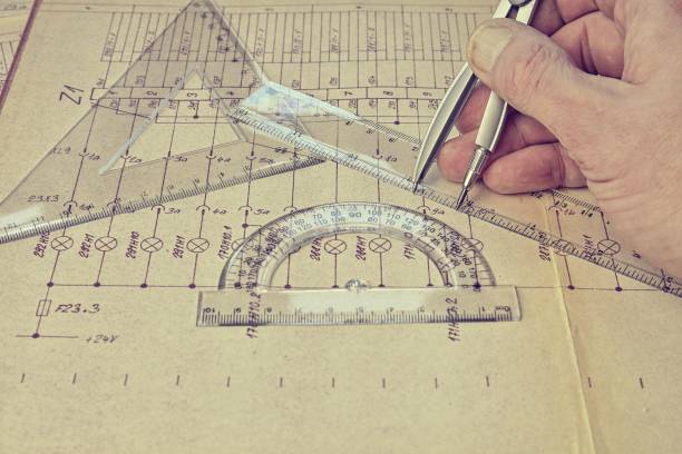 Electrical engineer workplace - electrotechnical project, rulers, and divider compass. Construction and electrotechnology concept. Engineering tools. Circuit diagram on background. Retro haze. Construction projects. Planning lugar de trabajo de ingeniero eléctrico: proyecto electrotécnico, reglas y brújula divisora. concepto de construcción y electrotecnología. herramientas de ingeniería. diagrama de circuito en segundo plano. neblina retro. proyectos de construcción. p
