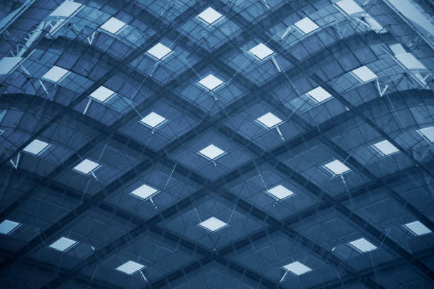 istock Computer graphic image of grid structure resembling futuristic building or modern architecture detail. Abstract geometric background with rhombus-shaped pattern in sky blue color. 1217199383
