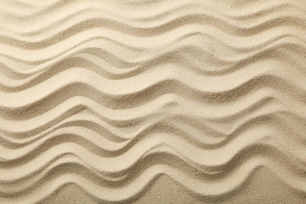 istock Dry sea sand with waves. Background. Summer. Vacation 1217199455