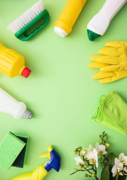 istock Cleaning products background, detergent bottles and tools 1217200392