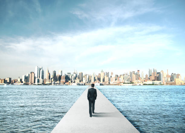istock Businessman walking to modern city 1217200396
