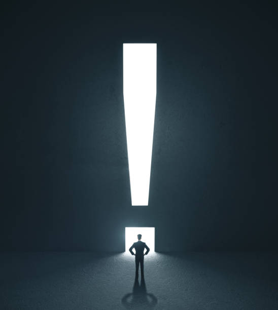 istock Businessman looking on door in form exclamation mark 1217200446