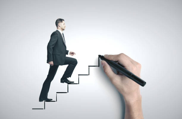 istock Businessman walking on drawing stairs. 1217200983