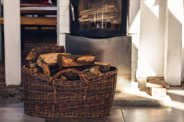 Composition, firewood, stove items, basket. real fireplace filled with firewood