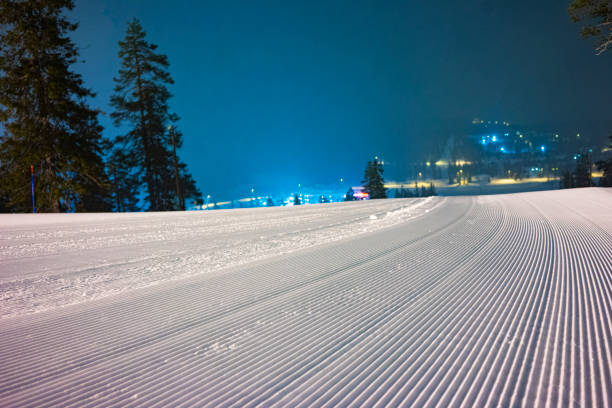 istock Ski slope in nights with lights from snowcats 1217203168