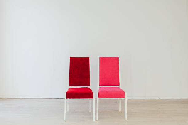 istock two chairs in the interior of an empty white room 1217203468