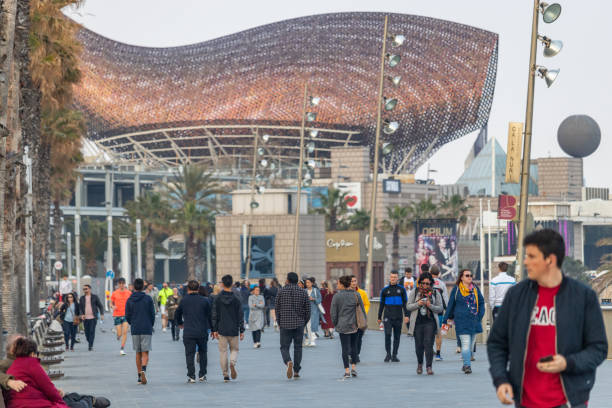 Barcelona, Spain. 14th March, 2020. Crowd walking on Barcelona seaside on a cloudy saturday afternoon despite the Spanish government declared alert state and asked people to stay at their homes