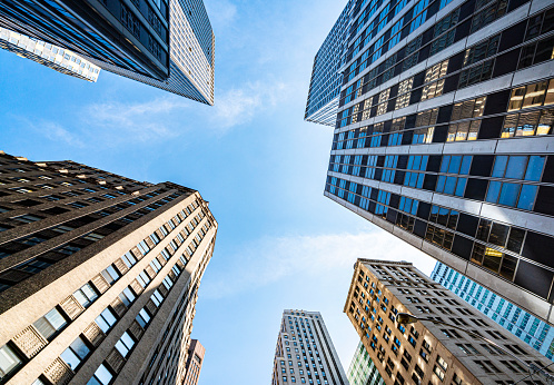 Low angle view of modern skyscrapers in Midtown Manhattan