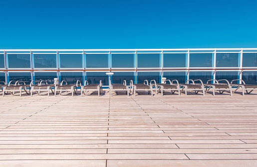 Abandoned Cruise Ship Deck with Empty Deckchairs. Crisis in Travel Industry Economical Concept.