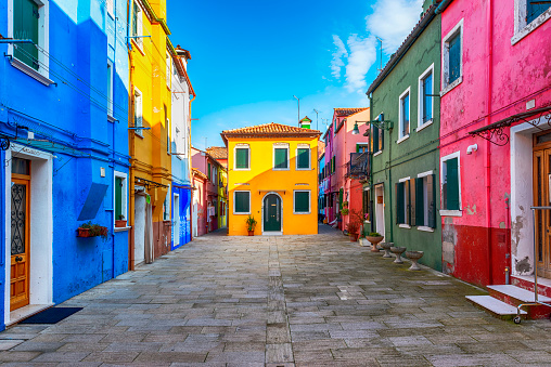 View of the colorful houses along the canal at the island of Burano near Venice, Italy.