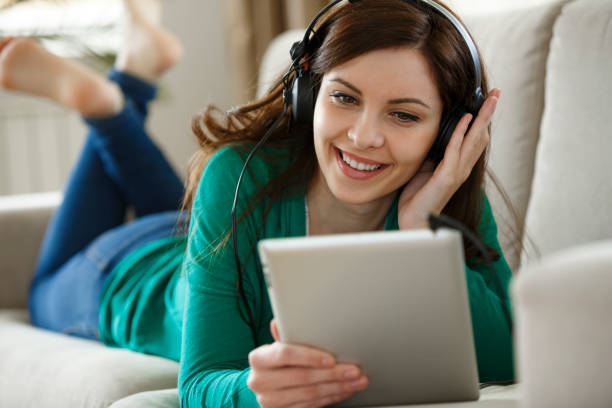 Young woman using digital tablet for video chatting during COVID-19 pandemic