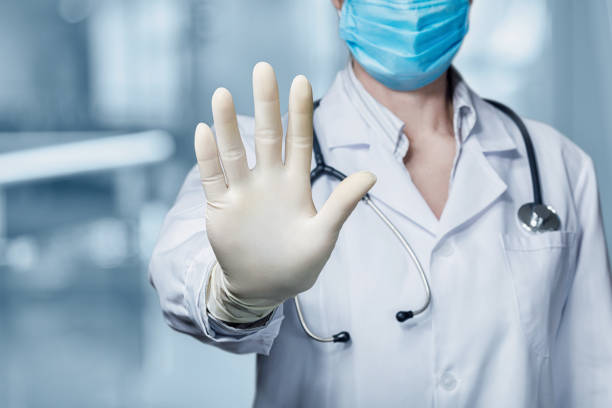 istock Doctor shows with his hand a ban . 1217214293