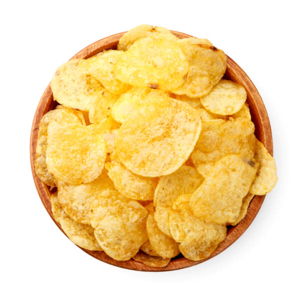 istock Potato chips in a wooden plate top view on a white. Isolated 1217215589