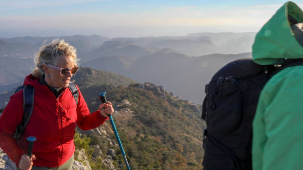 istock Hiking couple ascend mountain ridge 1217216452