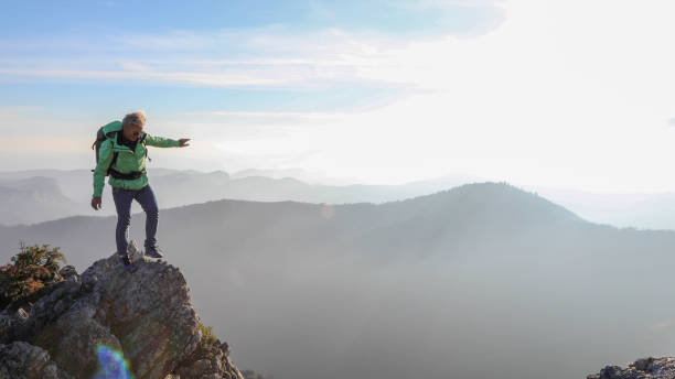 istock Male hiker ascends  mountain ridge 1217216567