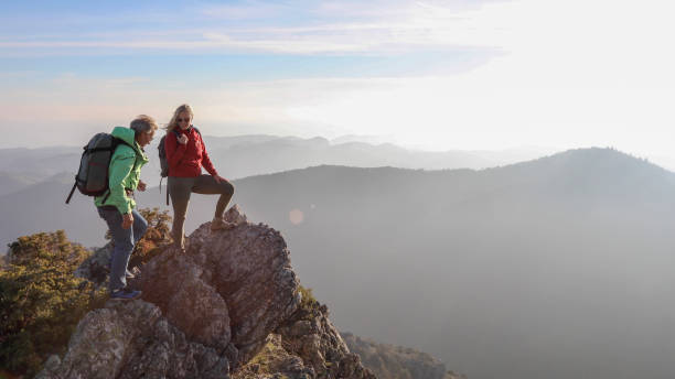 istock Hiking couple ascend mountain ridge 1217216601