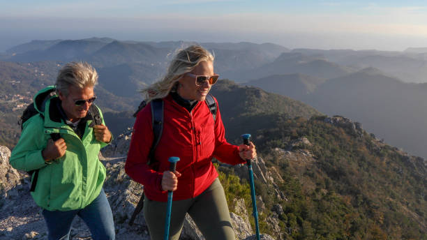 istock Hiking couple ascend mountain ridge 1217216666