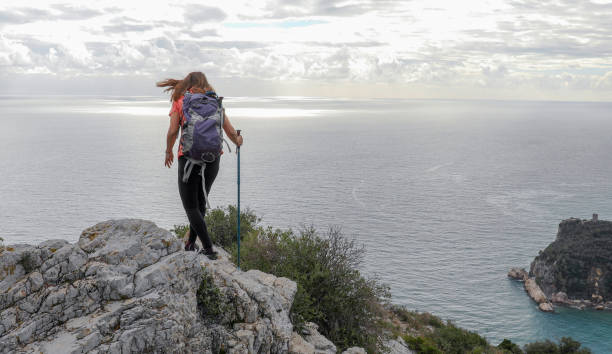 istock Female hiker ascends mountain ridge 1217216672