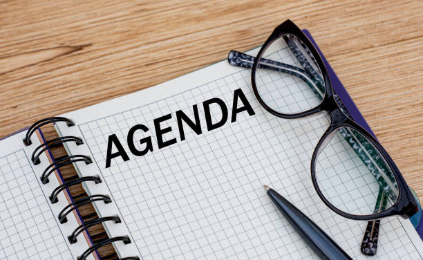 istock the word AGENDA is written in a notebook with glasses 1217216734
