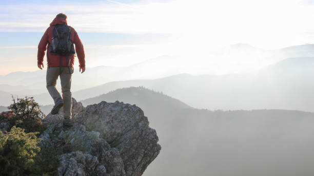 istock Male hiker ascends mountain ridge 1217216744