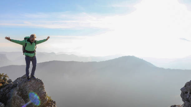 istock Male hiker ascends  mountain ridge 1217216746