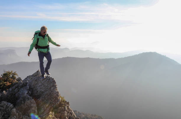 istock Male hiker ascends  mountain ridge 1217216772