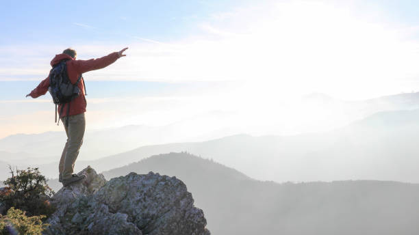 istock Male hiker ascends mountain ridge 1217216774